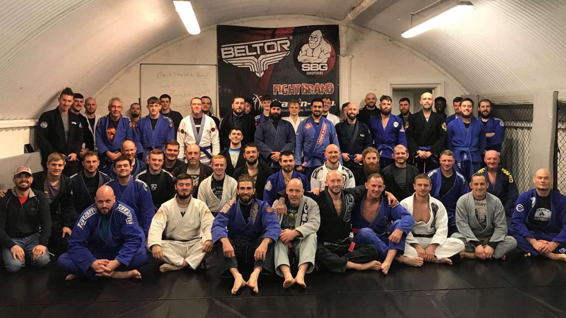 SBG Crewe members lined up in gi on the mats